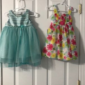 2 dresses for 2T girl 1 is aqua 1 is pink&yellow